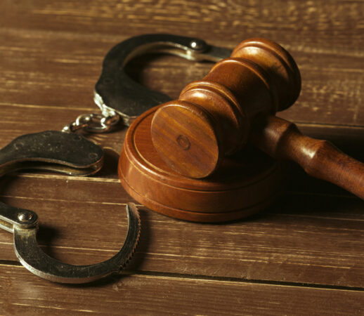 Close-up view of brown wooden mallet of judge